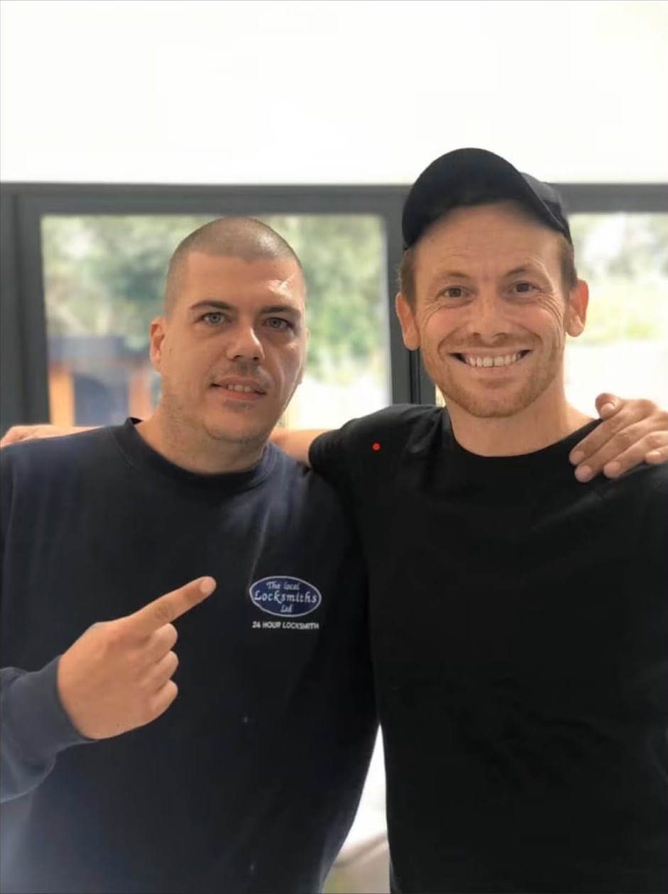 The Bow Locks locksmith handing over new keys to a customer in London